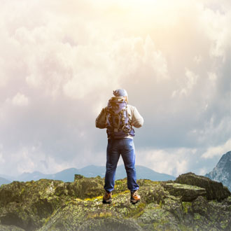 Man on top of a hill - Adventure Travel Show Man on top of a hill - Adventure Travel Show